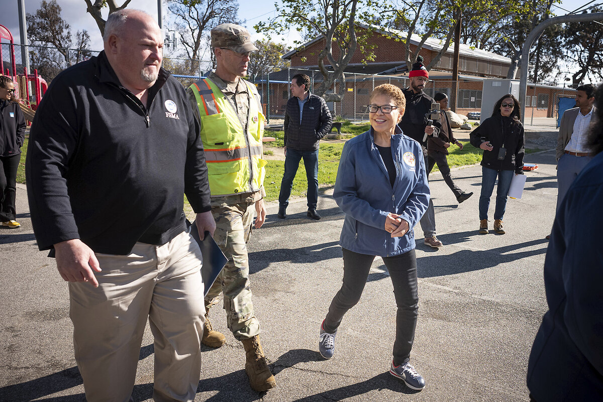 Los Angeles Mayor Karen Bass, right, arrives to a news conference in the Palisades with FEMA regional Director Bob Fenton, left, and Col. Eric Swenson of the Army Corps of Engineers on Thursday, March 6, 2025.   